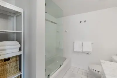 a white bathroom with a tub and a toilet at Miami Downtown Brickell spacious 4 Bedrooms 6 Beds in Miami