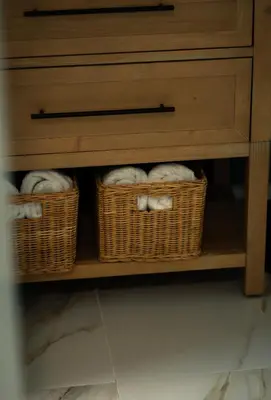 two baskets of towels are sitting in a cabinet at Fountain condo 2 story Pool BBQ Balcony in Miami Beach