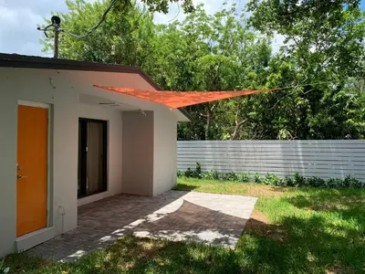 a small house with an orange roof at Harbourside Flats in Fort Lauderdale