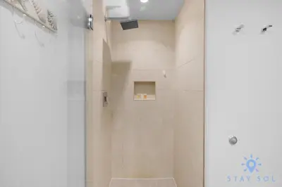 a bathroom with a shower with a glass door at Beachfront Resort - Hot Tub & Pool- Near Beach in Hollywood