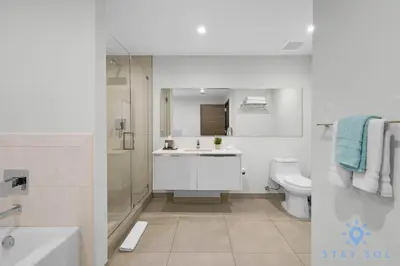 a bathroom with a sink and a toilet and a shower at Tropical Oasis - Rooftop Pool- Near Beach - Gym in Hollywood