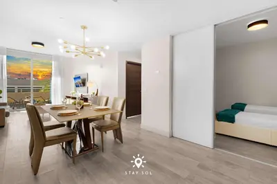 a dining room with a table and a bedroom at Modern Resort - Terrace - Up To 6 - Near Beach in Hollywood