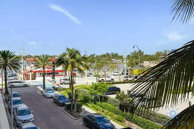 a parking lot with cars parked in a parking lot at Rooftop Pool - Hollywood Beach Boardwalk in Hollywood