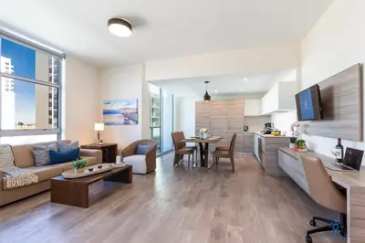 a living room with a couch and a table at Best Stay - Rooftop Pool - Hollywood Beach Board - walk in Hollywood