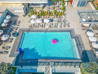 an overhead view of a swimming pool with chairs and umbrellas at Perfect Relax - Hollywood Beach - Amazing Pool in Hollywood