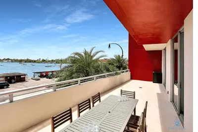 a balcony with a bench and a view of the water at Beachfront Condo-ROOFTO POOL- 2 BEDROOMS 2 BR ! in Hollywood