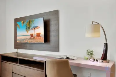 a desk with a computer and a monitor on a wall at Best Stay - Rooftop Pool & Hot Tub - Hollywood Beach in Hollywood