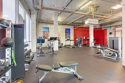 a gym with cardio equipment in a large room at Rooftop Pool - Balcony - Hollywood Beach Broad - walk in Hollywood