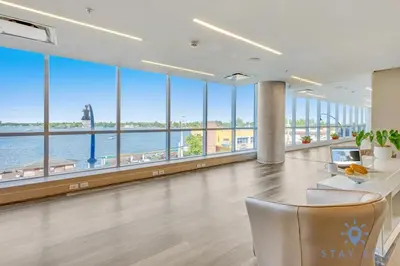 a large office with a view of the water at Costa Hollywood - Worth Traveling - Rooftop Pool- Gym in Hollywood