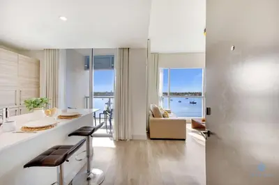 a kitchen and living room with a view of the ocean at Bay View - Balcony - Amazing Pool - Hollywood Beach in Hollywood