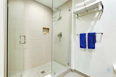 a shower with a glass door in a bathroom at Bay View - Balcony - Amazing Pool - Hollywood Beach in Hollywood