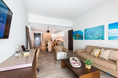 a living room with a couch and a table at Best Stay - Rooftop Pool - Broad - walk - Near Beach in Hollywood