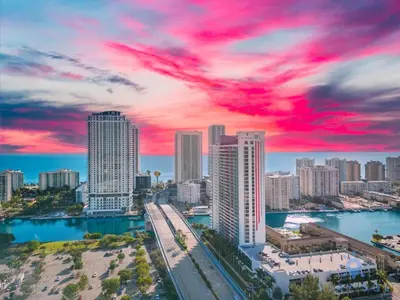 a view of a city skyline with a red sky at Amenities BALCONY w Stunning Views-Beachfront in Hallandale Beach