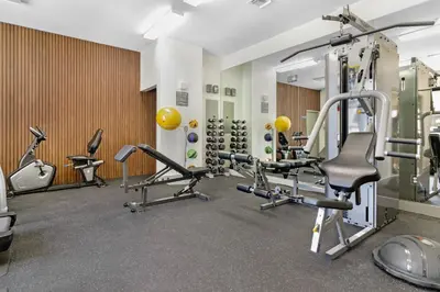a gym with several treadmills and cardio machines at Roami at Habitat Brickell in Miami