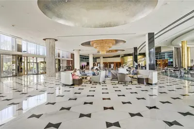 a lobby with black and white tiled floors at Studio at Sorrento Residences- FontaineBleau Miami Beach home in Miami Beach