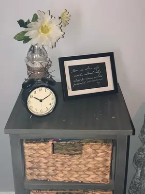 a clock sitting on top of a table with a picture at Private and Secluded Studio in Little Havana - 6V in Miami