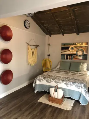 a bedroom with a bed and a clock on the wall at Private and Secluded Studio in Little Havana - 6V in Miami