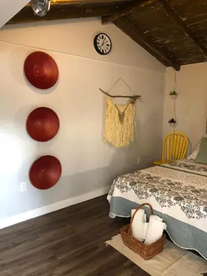 a bedroom with a bed and a clock on the wall at Private and Secluded Studio in Little Havana - 6V in Miami