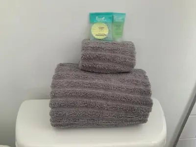 a pile of yarn sitting on top of a toilet at Hollywood Beach Apartments - Walk to the Beach in Hollywood