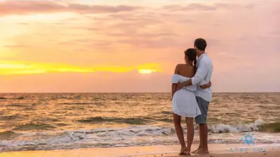 a couple standing on the beach watching the sunset at Rooftop Pool - Hot Tub -Hollywood Beach Boardwalk in Hollywood