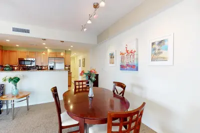 a kitchen and dining room with a table and chairs at Paradise Perch in Fort Lauderdale