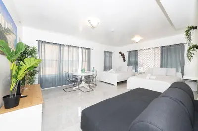 a living room with a couch and a table at Apartments on Ocean Drive in Miami Beach