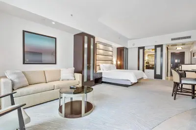 a living room with a couch and a bed at Junior Suite at Sorrento Residences- FontaineBleau Miami Beach home in Miami Beach
