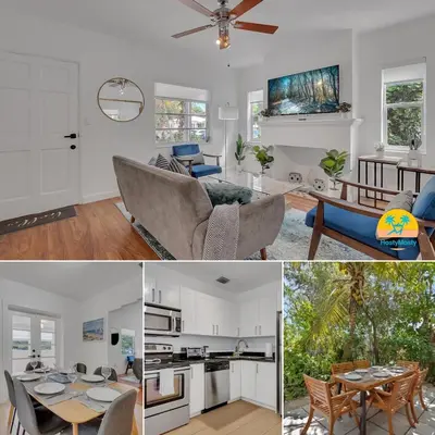 a living room and a kitchen with white cabinets at Casa Nikoleta Gated 3Bd 2Bth 10 Min to Beach in Miami