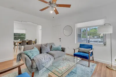 a living room with a couch and a ceiling fan at Casa Nikoleta Gated 3Bd 2Bth 10 Min to Beach in Miami