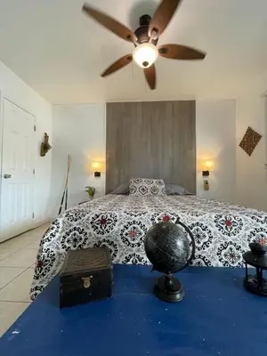 a bedroom with a bed with a ceiling fan at Cozy Studio near Coconut Grove in Miami