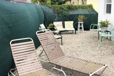 a group of chairs and tables in a yard at Chic and Comfortable Studio Free Street Parking in Miami