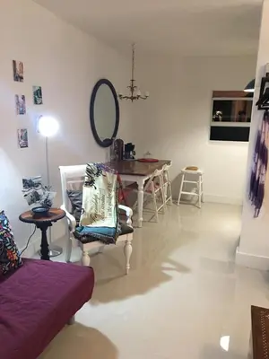 a living room with a table and a couch at Private Studio blocks from Coconut Grove in Miami