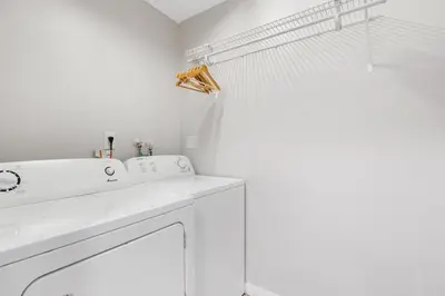 a white bathroom with a sink and a shower at The Home in The Oaks - By Avi in Fort Lauderdale