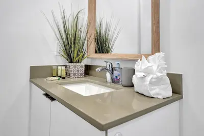 a bathroom counter with a sink and some plants at Cozy studio wbeach boardwalk steps kitchen in Hollywood