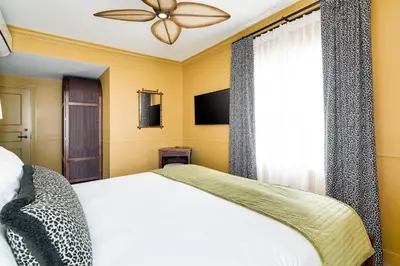 a bedroom with a bed and a ceiling fan at Esme Miami Beach in Miami Beach