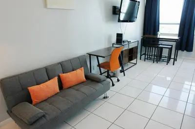 a living room with a couch and a table at Castle 705 in Miami Beach