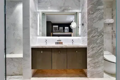 a bathroom with a sink and a mirror at Kaskades Hotel South Beach in Miami Beach