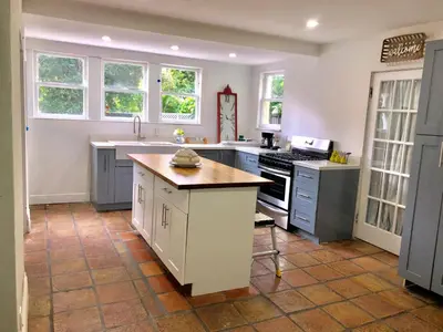 a kitchen with a sink and a stove at Spacious and Comfy Suite near MIA 2 Queen Beds in Miami