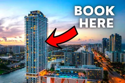 a red arrow pointing to a building in a city at Luxury Condo with Jacuzzi and Amenities in Hollywood