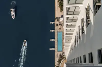 a boat in the water next to a building at Luxury Condo with Jacuzzi and Amenities in Hollywood