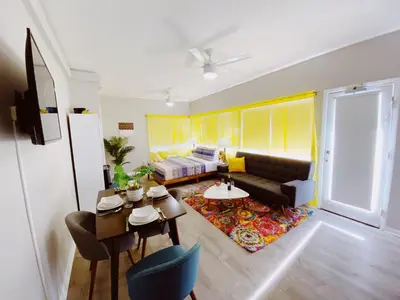 a living room with a couch and a table at Miami International by Lowkl in Miami Beach