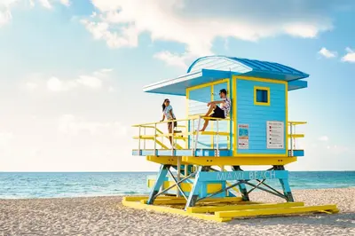 a life guard tower on the beach at The Samantha by Lowkl in Miami Beach