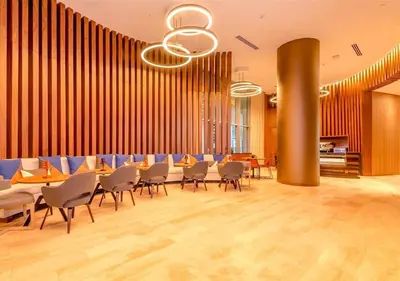 a restaurant with chairs and tables in a room at Life Resort on Miami Hollywood BeachFront by MRA in Hollywood