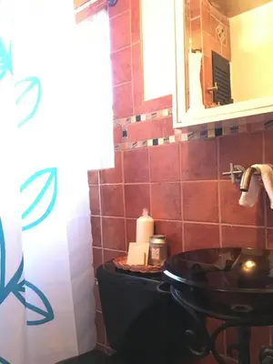 a bathroom with a sink and a mirror at Private room in the Heart of Little Havana in Miami