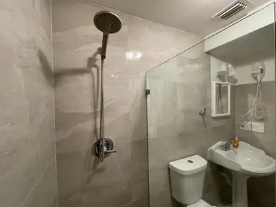 a bathroom with a shower and a toilet and a sink at Stay Near Miami's Cultural Heart With Wifi in Miami