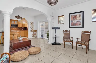 a living room with two chairs and a table at Private room in Little Havana in Miami