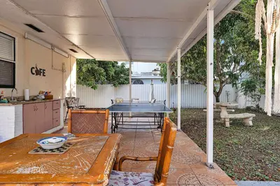 a patio with a ping pong table in a backyard at Private Studio in Little Havana in Miami