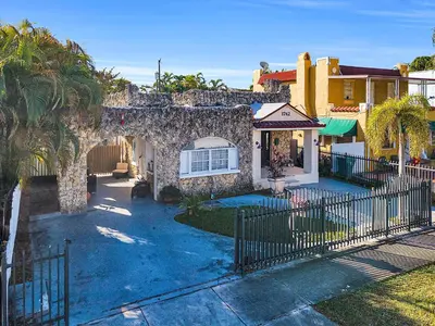 a house with a fence in front of it at Private Studio in Little Havana in Miami