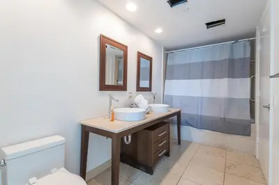 a bathroom with two sinks and a shower at ** W ICON BRICKELL-LUXURY UNIT- FREE SPA** in Miami