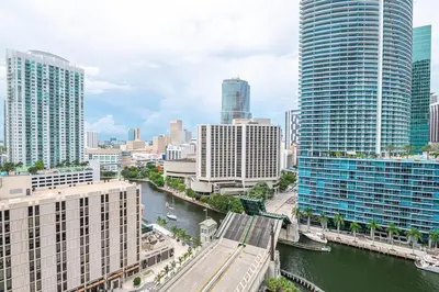 a view of a city with tall buildings and a river at ** W ICON BRICKELL-LUXURY UNIT- FREE SPA** in Miami
